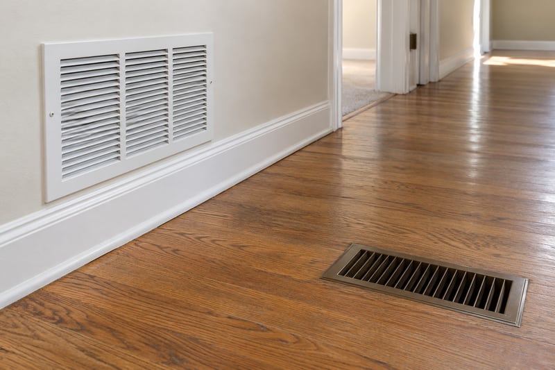 Return-air grille and floor register with clear space around them